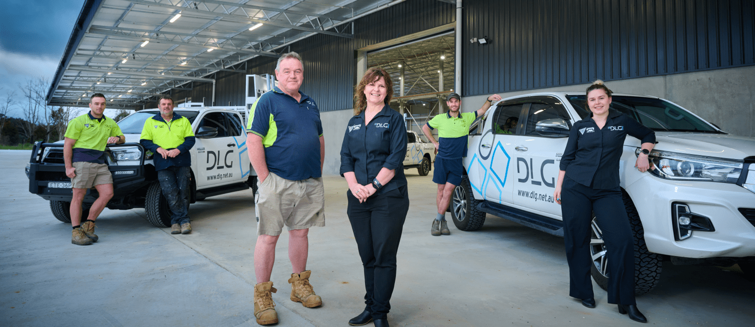 DLG Aluminium & Glazing team standing in front of company office and warehouse